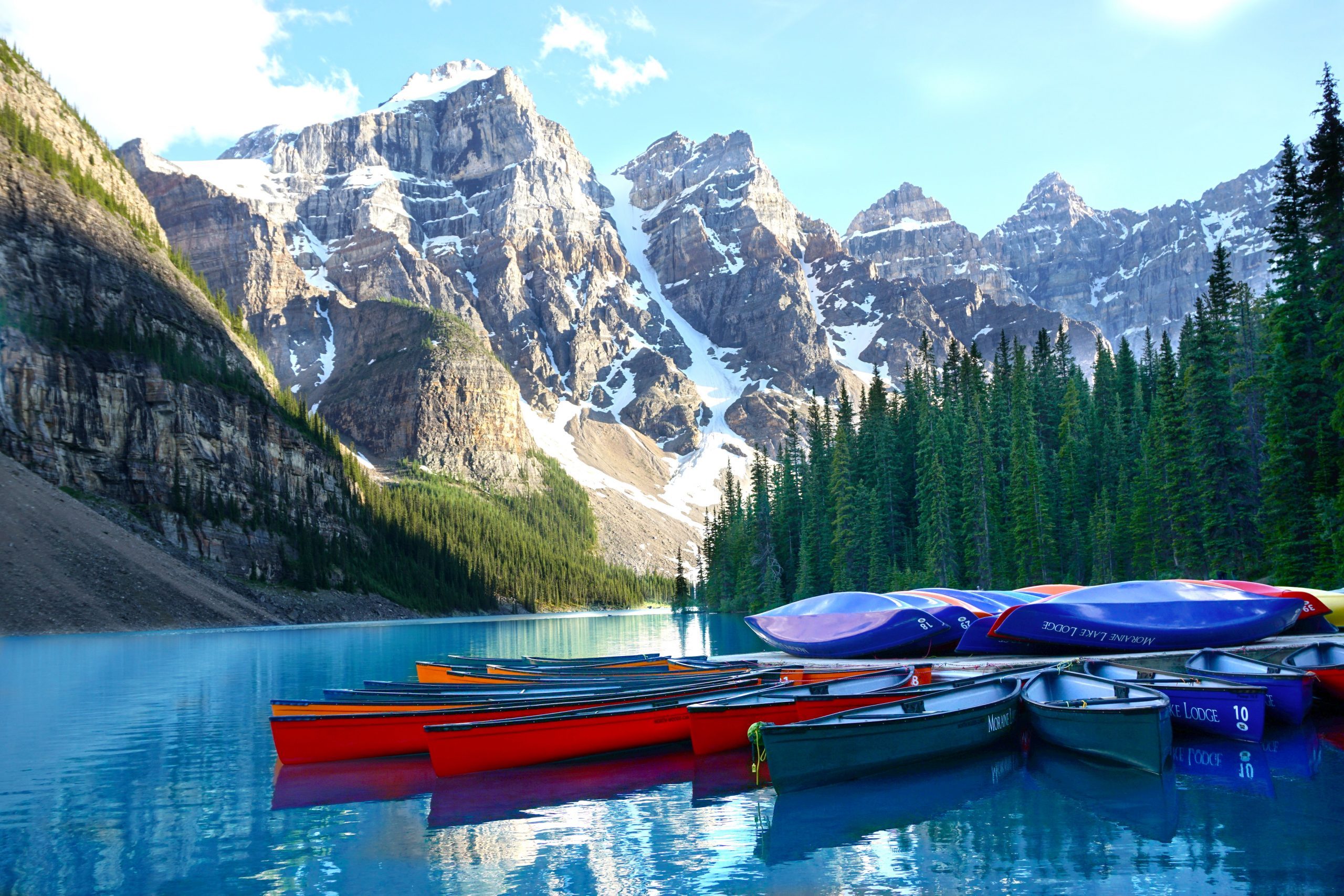 Canoes piled on the dock at the end of the day. Moraine Lake, Banff