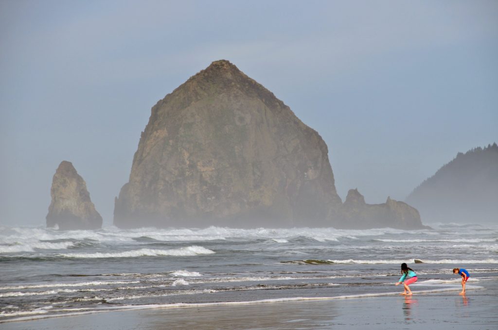 It is really more about splashing than swimming at Cannon Beach, even during summer