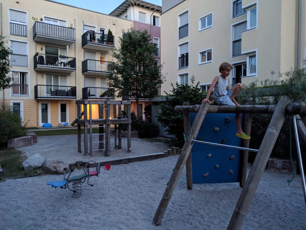 Artem, our son, alone at the playground (it is almost 9.30 pm).