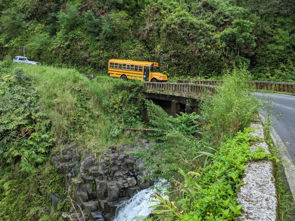 School bus on the one of the 46 one lane bridges. Road to Hana, Maui