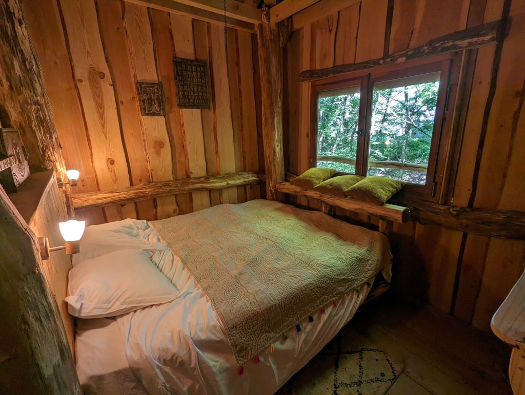Unique camping in France: our cozy bedroom in the tree house
