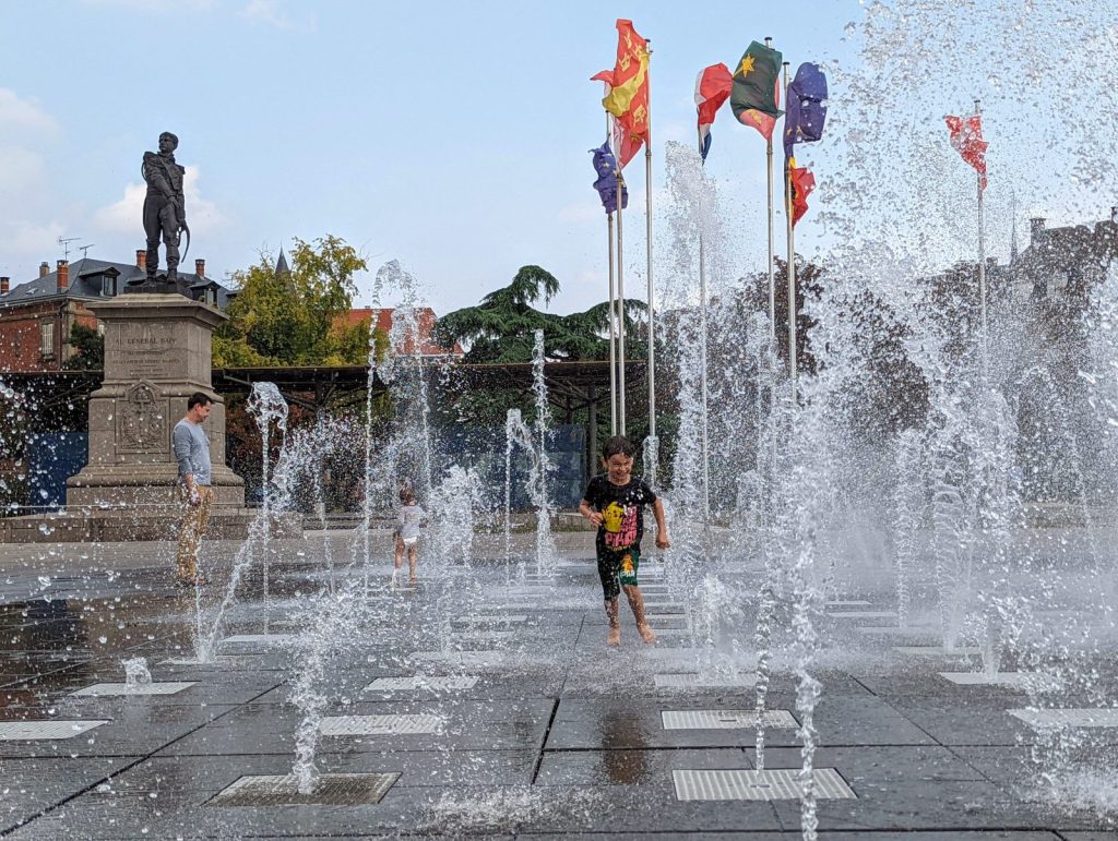 Andrew having fun at the Colmar "new town". Kids love those square