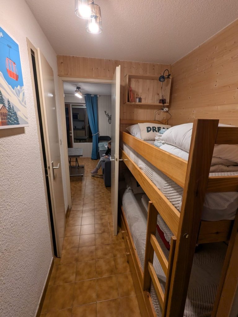 bunk bed and sofa for 2 people in the living room (plus a small kitchen)